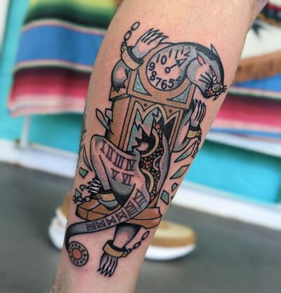Elegant traditional tattoo featuring a fierce panther with a clock, expertly done by Benji Charnock.