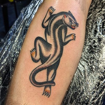 Get fierce with this classic panther design by Benji Charnock, expert in traditional tattoos.