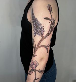 Get a stunning floral tattoo by Kiky Flore, featuring a beautiful botanical branch design. Perfect for nature lovers!