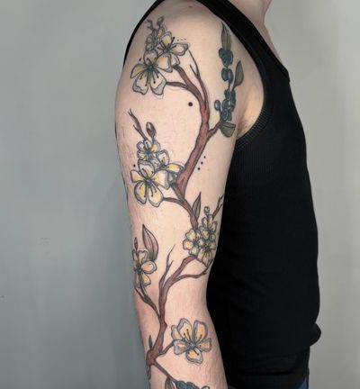Beautiful illustrative floral tattoo featuring a blueberry branch and botanical elements by Kiky Flore.