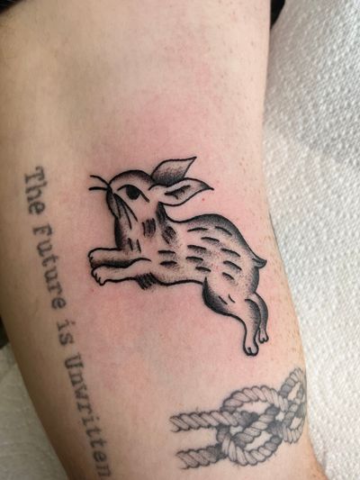 Get a timeless and classic bunny tattoo done in traditional style by the talented artist Clara Colibri.