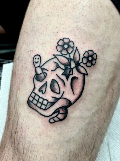 Explore the bold and classic style of a traditional skull tattoo by the talented artist Clara Colibri. A timeless design for those seeking a striking piece of body art.