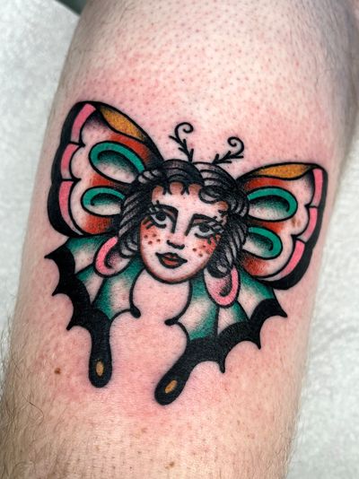 Explore the beauty of a traditional tattoo featuring a stunning butterfly and elegant lady design by Clara Colibri.