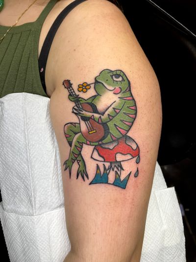 This traditional style frog tattoo by Clara Colibri is a playful and colorful tribute to nature's amphibians.