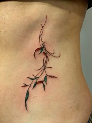 Fine-line vine tattoo by Epic Tattoos Guildford - perfect for a touch of nature-inspired beauty.