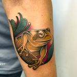 Hop into whimsical fantasy with this illustrative frog tattoo by Ben Prescott, merging old-school charm with a modern twist.