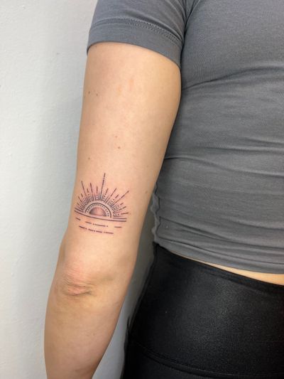 Beautiful fine line illustrative tattoo of a sunset with the sun setting on the horizon, done by artist Ben Prescott.