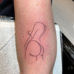 Ben Prescott's fine line tattoo delicately captures the beauty and grace of a woman in a minimalist outline design.