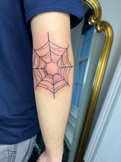 Unique and delicate web design by tattoo artist Ben Prescott, perfect for spider fans.
