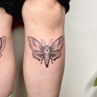 Experience the mesmerizing beauty of a dotwork moth tattoo, skillfully crafted by Michelle Harrison.
