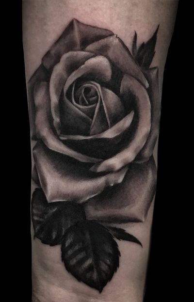 Get inked with a stunning black & gray rose tattoo created by the talented artist Pete Bienge. Embrace the beauty of nature with this realistic design.