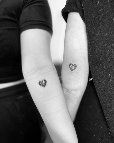Get a sleek and bold chrome heart tattoo in black and gray illustrative style by the talented artist Vera.