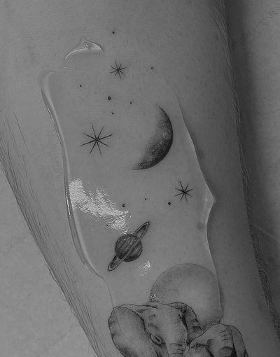 Capture the magic of the night sky with this illustrative tattoo featuring a moon, planet, star, and Saturn. Designed by Vera.