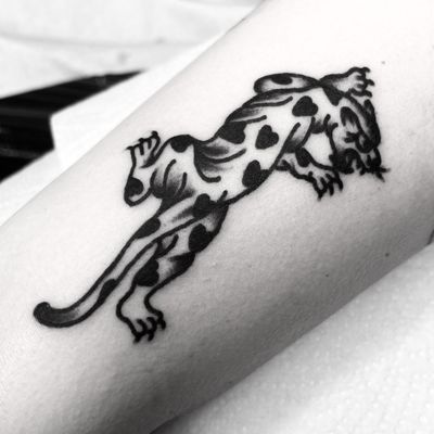 Get inked with a fierce and bold traditional tattoo of a leopard, panther, or jaguar by Alessandro Lanzafame.