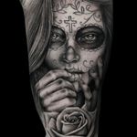 This chicano black and gray realism tattoo of a katrina woman by Pete Bienge showcases intricate detailing and stunning artistry.