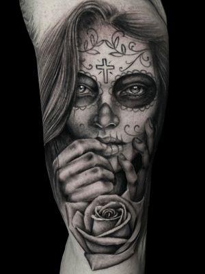 This chicano black and gray realism tattoo of a katrina woman by Pete Bienge showcases intricate detailing and stunning artistry.
