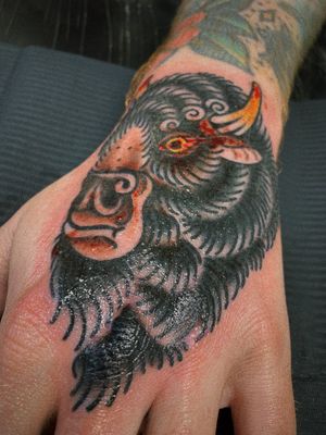 Capture the power and strength of the majestic bison with this traditional style tattoo by artist Laurel.