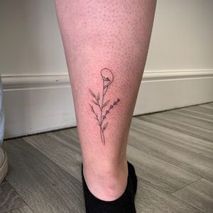 Experience the beauty of fine line art with this elegant flower tattoo design by the talented artist Chloe Hartland.