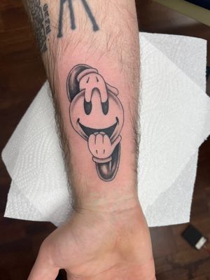 Get a unique and playful illustrative smiley face tattoo by the talented artist Clayton Jeremiah. Add some fun and positivity to your body art!