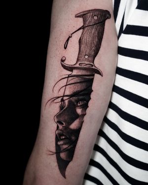 Knife and lady face mash up black and grey realism tattoo.
