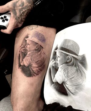 Capture the innocence and beauty of childhood with this stunning black and gray portrait tattoo by Saka Tattoo. Perfect for those who cherish memories of youth.