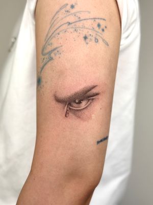 Unique dotwork, hand-poked, micro-realism eye tattoo by Alina Wiltshire. Intricately detailed design that captures your gaze.