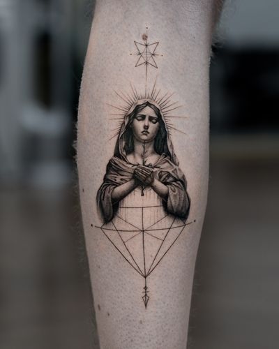 Explore the beauty of fine line and micro-realism in this black & gray geometric tattoo of Mary by Delphin Musquet.