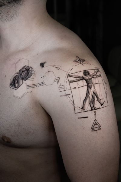 Experience the beauty of fine line, geometric, and micro realism styles in this intricate tattoo of the iconic Vitruvian Man by Delphin Musquet.