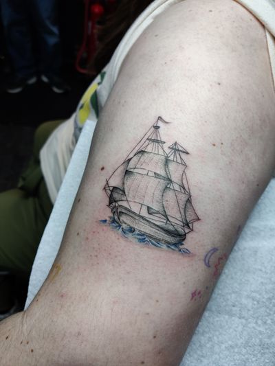 Sail away with this fine line, illustrative boat tattoo by acclaimed artist Mary Shalla. A sleek and minimal design for those who love the open sea.