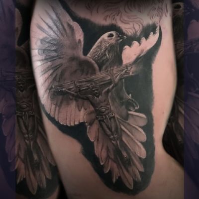 Capture the beauty of faith and peace with this stunning black and gray tattoo by Gaston Gromnicki. Perfect blend of realism and spirituality.