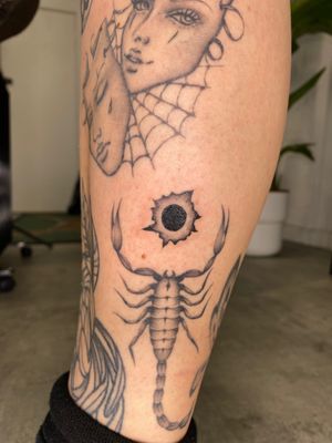 Unique bullet hole design by tattoo artist Charlie Macarthur, showcasing his illustrative style.