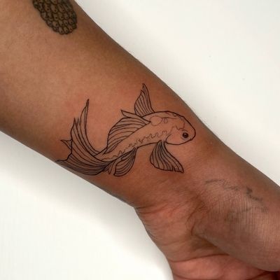 Experience the beauty of fine line illustration with this delicate koi fish tattoo by the talented artist Michelle Harrison.
