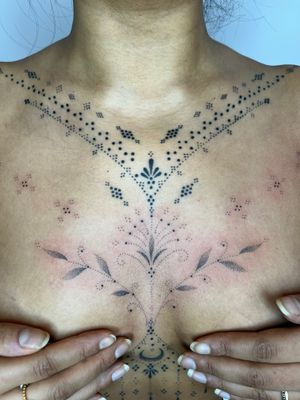 Elegantly hand-poked by Indigo Forever Tattoos, this delicate and intricate dotwork tattoo features a beautiful ornamental pattern.