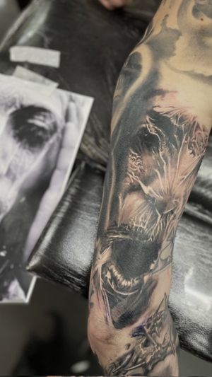 Experience intricate texture and realism with this black and gray tattoo by Gaston Gromnicki, featuring a stunning depiction of a woman with a plastic aesthetic.