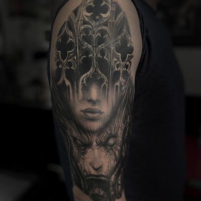 Experience spine-chilling horror with this stunning black and gray realism tattoo by renowned artist Gaston Gromnicki.
