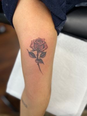 Beautiful rose tattoo by Clayton Jeremiah, featuring floral illustrative style. Perfect for arm placement.