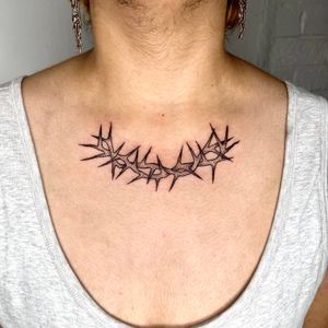 Explore the beauty in darkness with this blackwork illustrative tattoo featuring intricate thorns by Michelle Harrison.