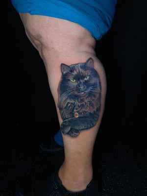 Capture your beloved pet with a stunning realistic portrait tattoo by artist Marie Terry.