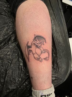 Get inked with a stunning anime style Charizard tattoo by the talented artist Marie Terry. Show your love for this iconic Pokemon with a unique twist!