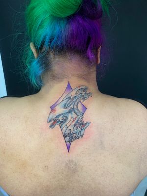 Get a stunning anime-style tattoo of Yu Gi Oh's iconic Blue Eyed White Dragon by talented artist Marie Terry. Perfect for any fan of the classic card game!