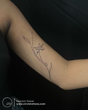 Flower line art tattoo done by Swarain Pawar at Circle Tattoo Dadar