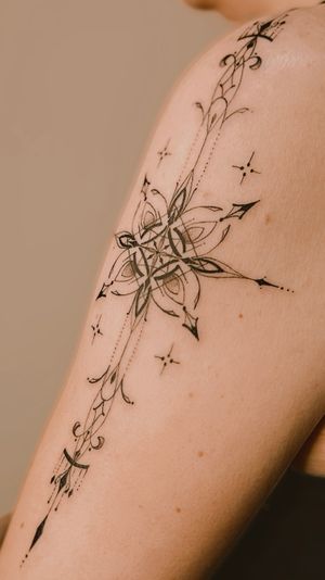 vertical ornament on the arm, fine line ornamental tattoo 
