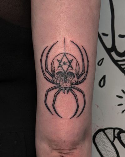 A striking blackwork and dotwork hand-poked tattoo featuring a spider and skull motif, expertly done by Alien Ink.