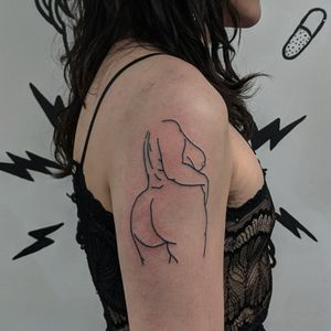 Get a stunning fine line illustrative tattoo of a woman's outline by Alien Ink for a chic and timeless look.