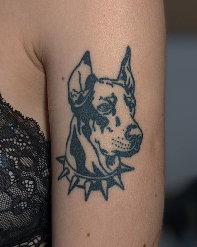 Get a striking blackwork tattoo of a fierce doberman from the talented artists at Alien Ink. Perfect for dog lovers and tattoo enthusiasts alike.