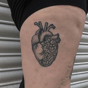 Unique hand_poked illustrative tattoo by Alien Ink featuring a detailed heart and brain design in blackwork and dotwork style.