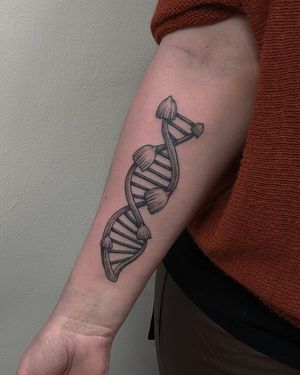 Get a unique hand-poked blackwork DNA tattoo by Alien Ink, combining dotwork and illustrative styles for a one-of-a-kind design.