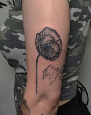 Beautiful blackwork and dotwork flower tattoo created with precision by Alien Ink, showcasing unique hand-poked technique.