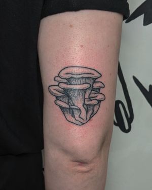 Explore the enchanting world of blackwork, dotwork, and hand_poked tattoos with this unique mushroom design by Alien Ink.