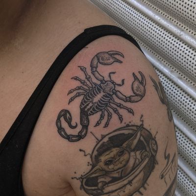 Experience the magic of blackwork, dotwork, and illustrative styles with this hand-poked scorpion tattoo by Alien Ink.